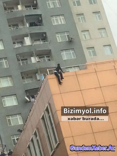 Bakıda vətəndaş özünü binadan atmaq istəyir - SON DƏQİQƏ (FOTOLAR)