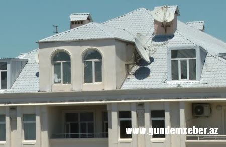 Monolit” MTK binanın üstündə əlavə evlər tikib satır